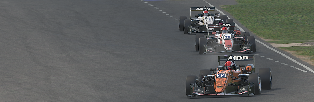 F3 cars taking turn one at Knockhill in iRacing